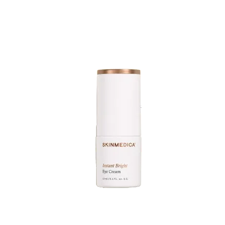 A white cylindrical bottle of SKINMEDICA Instant Bright Eye Cream with a metallic rose gold cap, centered on a plain white background.